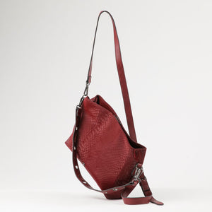 Cartera Bandolera Flora Ecocuero burdeo ojetillos Humana