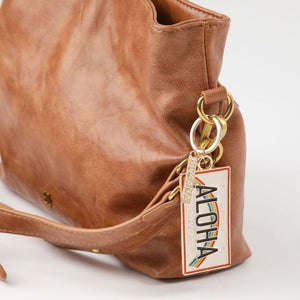 Llavero Aloha Dorado Humana