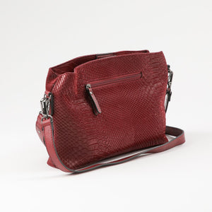 Cartera Bandolera Flora Ecocuero burdeo ojetillos Humana