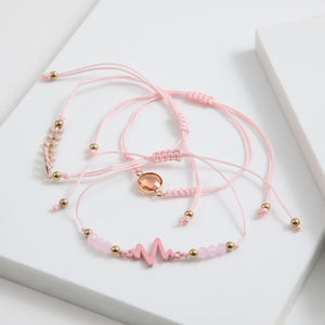 Set de 3 pulseras Pini Hilo rosado ID