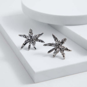 Aros Pegado Camelia Plateado Humana